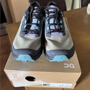 On Running Black and Blue Athletic Shoes with Cushioning Pods